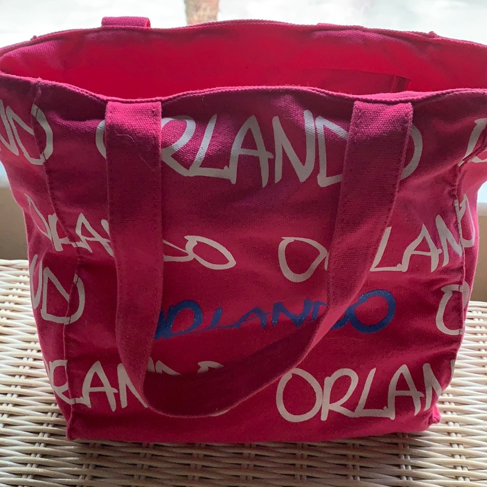 Pink small tote.  Can be used for anything.
